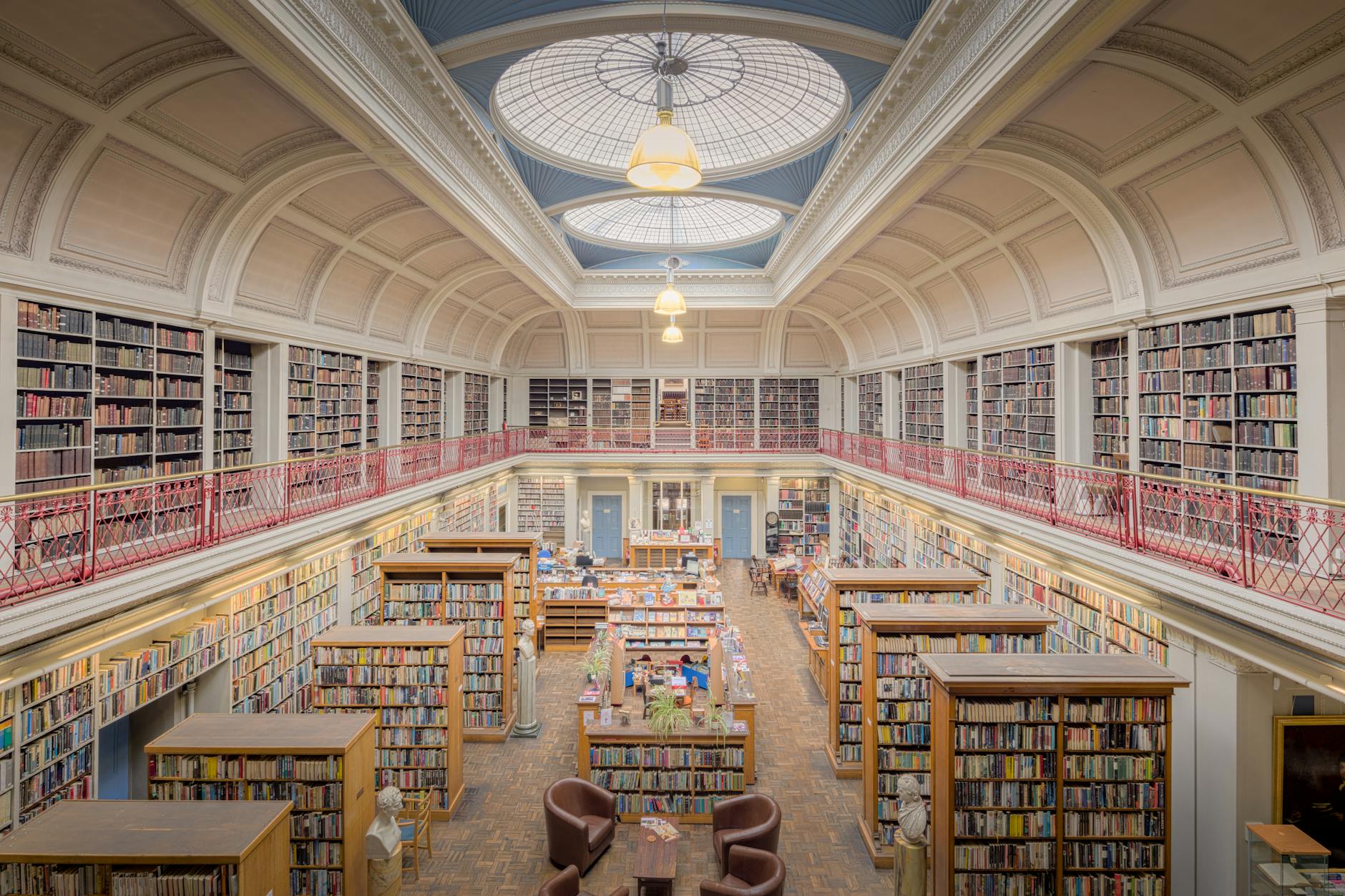 Beautiful interior of a historic library in England with bookshelves and dome ceiling.