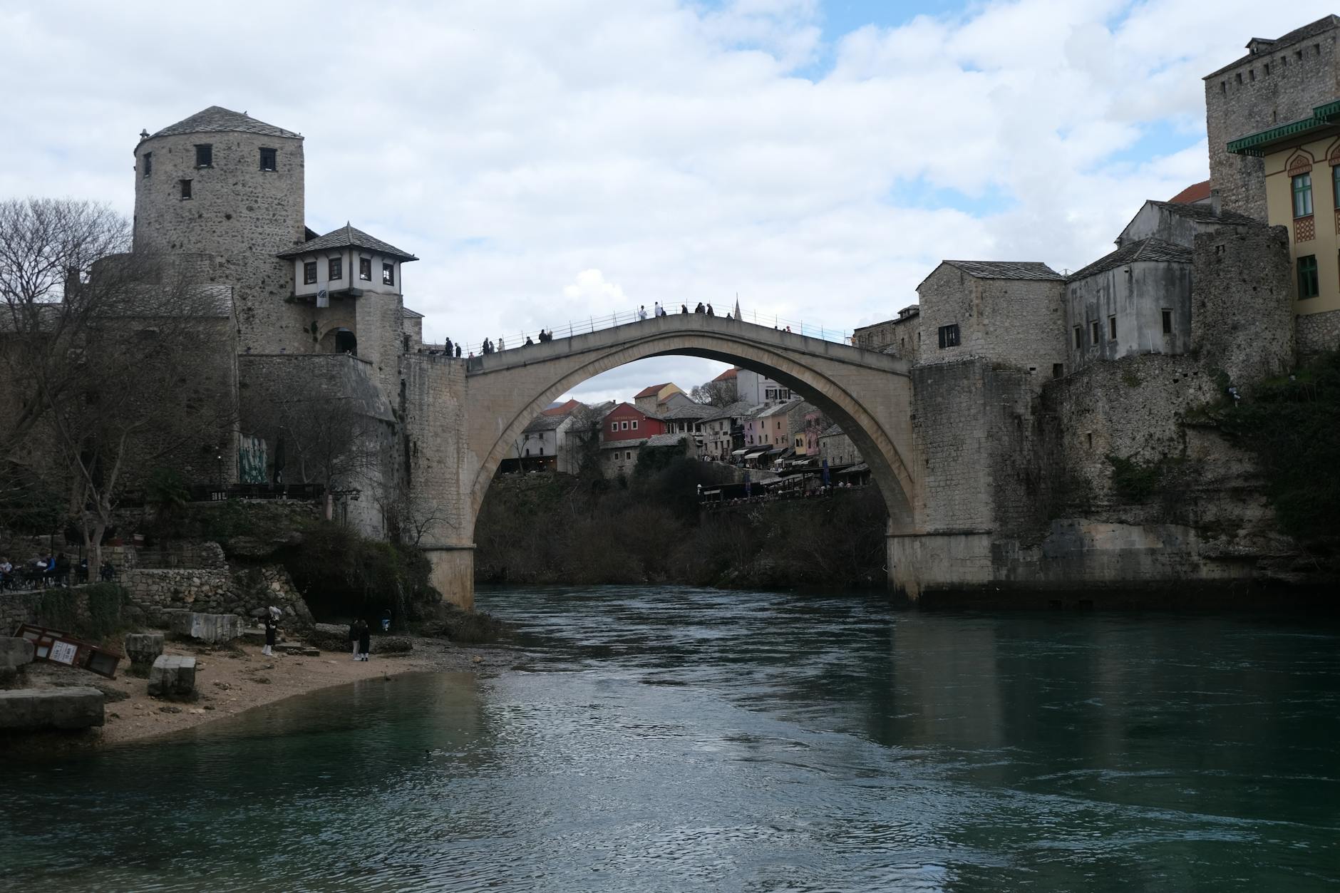 Beautiful shot of Mostar's iconic Old Bridge spanning the Neretva River, showcasing historic architecture.